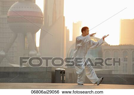Chinese man doing tai chi on the Bund, Shanghai, China View Large Photo Image Stock Photograph - Chinese man doing tai chi on the Bund, Shanghai, China. Fotosearch