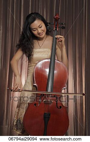 Chinese Woman playing the cello View Large Photo Image Picture - Chinese Woman playing the cello. Fotosearch
