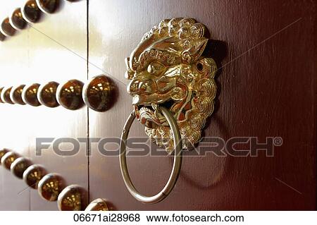 Stock Photo - Close up of bronze Chinese door knocker, Chiang Kai Shek Memorial. Fotosearch