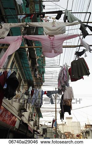 Clothes hanging out to dry in China View Large Photo Image Stock Photograph - Clothes hanging out to dry in China. Fotosearch