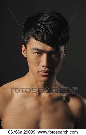 Stock Photo - Head shot of shirtless young man. Fotosearch