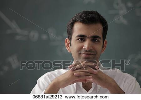 Head shot of young man with hands folded. View Large Photo Image Stock Image - Head shot of young man with hands folded.. Fotosearch
