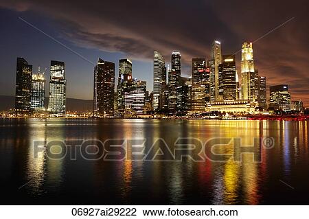 Marina Bay and city skyline reflected in the water at night, Singapore View Large Photo Image Stock Image - Marina Bay and city skyline reflected in the water at night, Singapore. Fotosearch