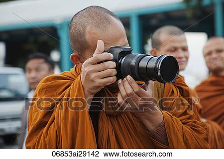 Monk taking photos with camera, Bangkok, Thailand View Large Photo Image Stock Image - Monk taking photos with camera, Bangkok, Thailand. Fotosearch