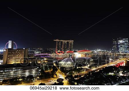 Night view of buildings surrounding Marina Bay, Singapore View Large Photo Image Stock Photo - Night view of buildings surrounding Marina Bay, Singapore. Fotosearch