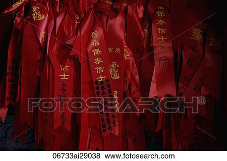 Red ribbons with prayers written on them. Shanghai, China View Large Photo Image Stock Photo - Red ribbons with prayers written on them. Shanghai, China. Fotosearch