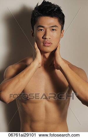 Shirtless young man with hands on neck View Large Photo Image Stock Image - Shirtless young man with hands on neck. Fotosearch