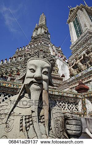 Stock Photo - Stone statue in front of Wat Arun, Temple of Dawn, Thailand, Bangkok. Fotosearch