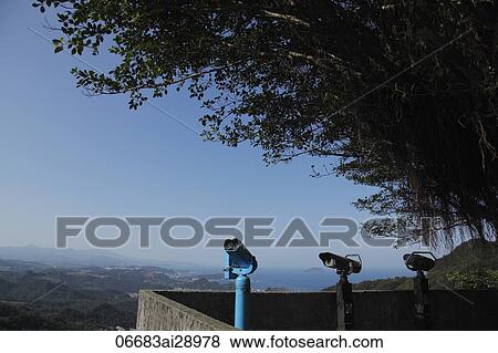 Stock Photo - Telescopes over looking view from Jiufen, Taiwan. Fotosearch
