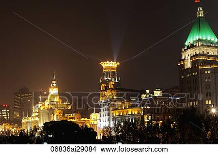 The buildings of the Bund at night. Peace Hotel in foreground, Shanghai, China View Large Photo Image Picture - The buildings of the Bund at night. Peace Hotel in foreground, Shanghai, China. Fotosearch