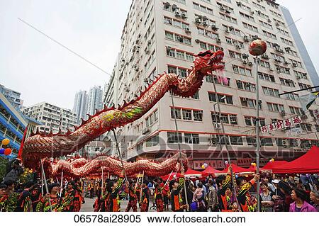 Traditional Chinese Dragon dance being performed on the street, Tai Kok Tsui Temple Fair. Hong Kong, China View Large Photo Image Stock Photography - Traditional Chinese Dragon dance being performed on the street, Tai Kok Tsui Temple Fair. Hong Kong, China. Fotosearch