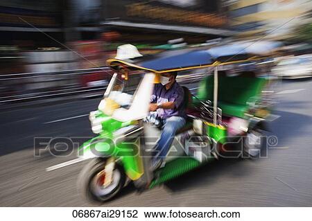 Tuk Tuk driving down the road. Bangkok, Thailand View Large Photo Image Stock Image - Tuk Tuk driving down the road. Bangkok, Thailand. Fotosearch