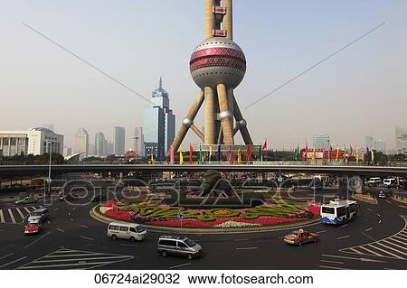 View of Pearl Tower with round about in foreground, Shanghai, China View Large Photo Image Stock Image - View of Pearl Tower with round about in foreground, Shanghai, China. Fotosearch
