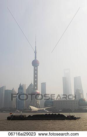 Stock Image - View of the skyline and Pearl tower on a smoggy day, Shanghai, China. Fotosearch