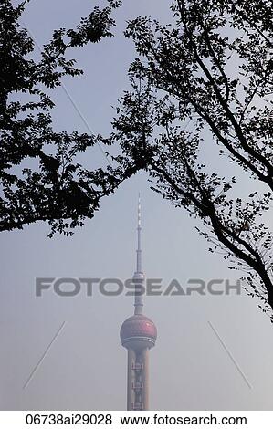 View of the top of Pearl Tower with trees in foreground View Large Photo Image Stock Photo - View of the top of Pearl Tower with trees in foreground. Fotosearch