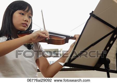 Young girl playing violin View Large Photo Image Stock Image - Young girl playing violin. Fotosearch