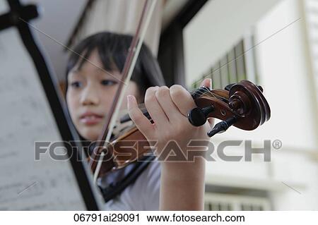 Young girl playing violin View Large Photo Image Stock Image - Young girl playing violin. Fotosearch