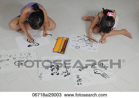 Young girls drawing pictures with Chinese brush and ink View Large Photo Image Stock Image - Young girls drawing pictures with Chinese brush and ink. Fotosearch