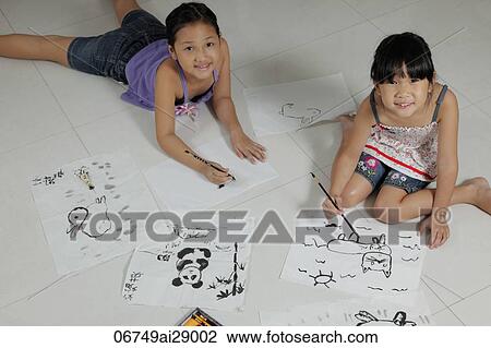 Young girls drawing pictures with Chinese brush and ink View Large Photo Image Stock Image - Young girls drawing pictures with Chinese brush and ink. Fotosearch