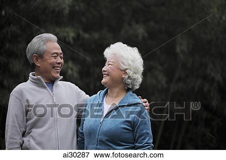A senior couple looking at each other smiling View Large Photo Image Stock Photo - A senior couple looking at each other smiling. Fotosearch