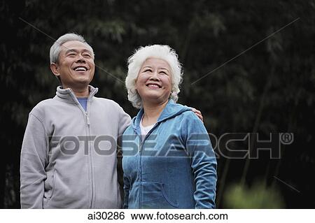 A senior couple looking up and smiling View Large Photo Image Stock Photograph - A senior couple looking up and smiling. Fotosearch