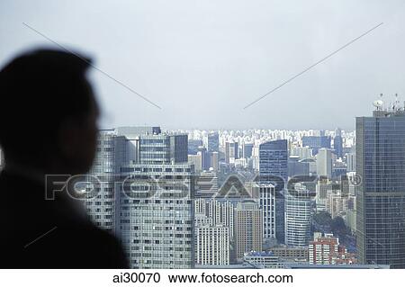 Blurred image of man looking out window View Large Photo Image Stock Image - Blurred image of man looking out window. Fotosearch