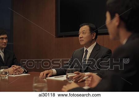 Businessmen having a meeting View Large Photo Image Stock Photo - Businessmen having a meeting. Fotosearch