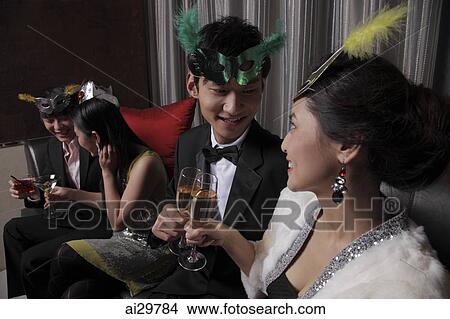 Couples celebrating at a party together View Large Photo Image Picture - Couples celebrating at a party together. Fotosearch