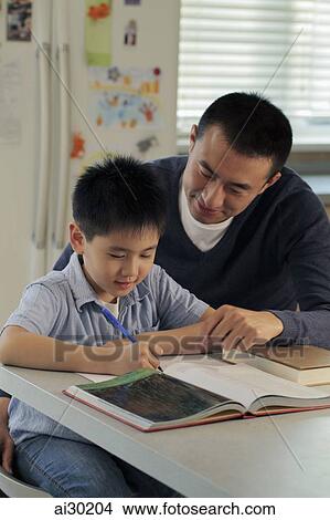 Father helping son with his homework View Large Photo Image Picture - Father helping son with his homework. Fotosearch