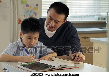 Father helping son with his homework View Large Photo Image Stock Image - Father helping son with his homework. Fotosearch