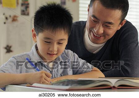 Stock Photography - Father helping son with his homework. Fotosearch