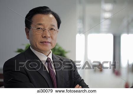 Stock Photo - Head shot of business man in office. Fotosearch
