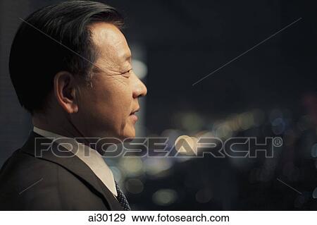 Head shot of man looking out the window at night View Large Photo Image Stock Photo - Head shot of man looking out the window at night. Fotosearch