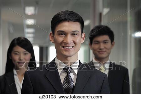 Head shot of three businesspeople in office View Large Photo Image Stock Image - Head shot of three businesspeople in office. Fotosearch
