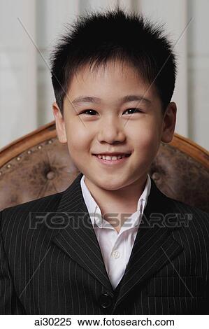 Head shot of young boy smiling View Large Photo Image Stock Photography - Head shot of young boy smiling. Fotosearch