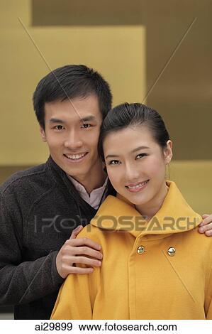 Stock Photo - Head shot of young couple together. Fotosearch