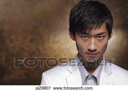 Head shot of young man in white coat View Large Photo Image Stock Photo - Head shot of young man in white coat. Fotosearch