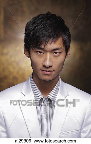 Head shot of young man in white coat View Large Photo Image Stock Photograph - Head shot of young man in white coat. Fotosearch