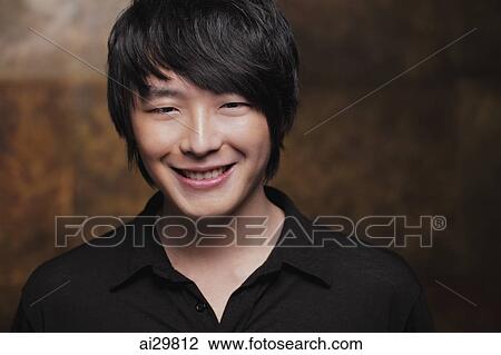 Head shot of young man smiling at camera View Large Photo Image Stock Image - Head shot of young man smiling at camera. Fotosearch