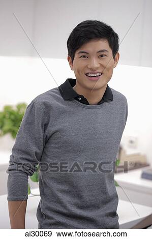 Head shot of young man smiling View Large Photo Image Stock Photo - Head shot of young man smiling. Fotosearch