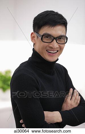 Head shot of young man wearing glasses and smiling View Large Photo Image Picture - Head shot of young man wearing glasses and smiling. Fotosearch