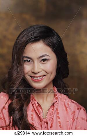 Picture - Head shot of young woman smiling. Fotosearch