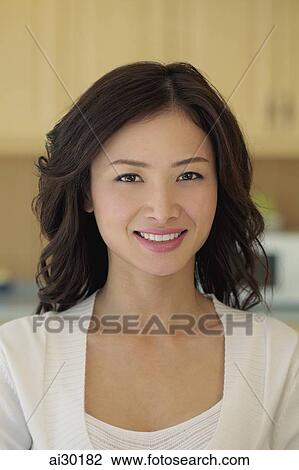 Head shot of young woman smiling View Large Photo Image Stock Image - Head shot of young woman smiling. Fotosearch