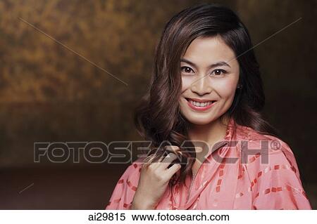 Stock Photography - Head shot of young woman smiling. Fotosearch