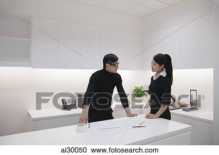 Man and woman working in modern office building View Large Photo Image Stock Image - Man and woman working in modern office building. Fotosearch