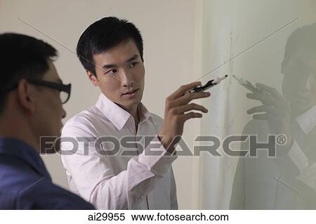 Man explaining something on white board. View Large Photo Image Stock Photography - Man explaining something on white board.. Fotosearch