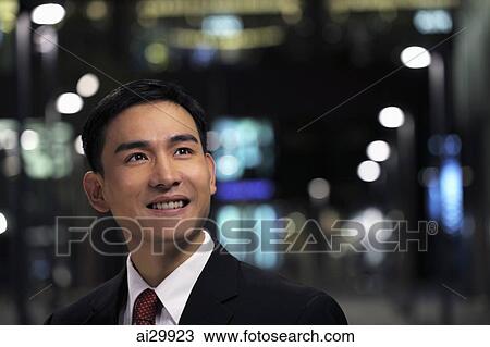 Man wearing business suit on the street at night View Large Photo Image Stock Image - Man wearing business suit on the street at night. Fotosearch