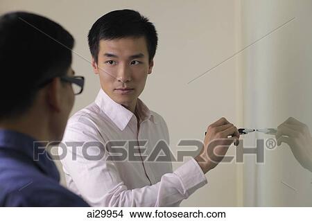 man writing on white board View Large Photo Image Picture - man writing on white board. Fotosearch