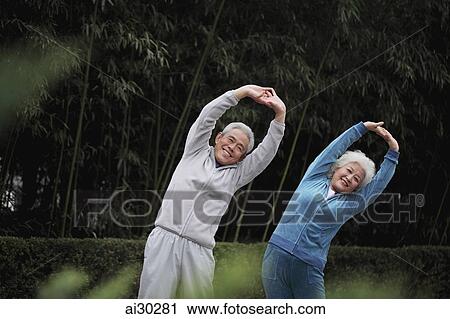 Older man and woman stretching together outdoors View Large Photo Image Stock Image - Older man and woman stretching together outdoors. Fotosearch
