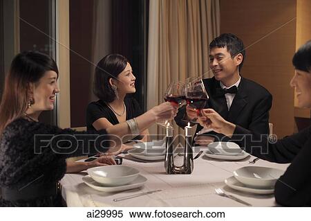 People toasting during a dinner party View Large Photo Image Stock Photography - People toasting during a dinner party. Fotosearch